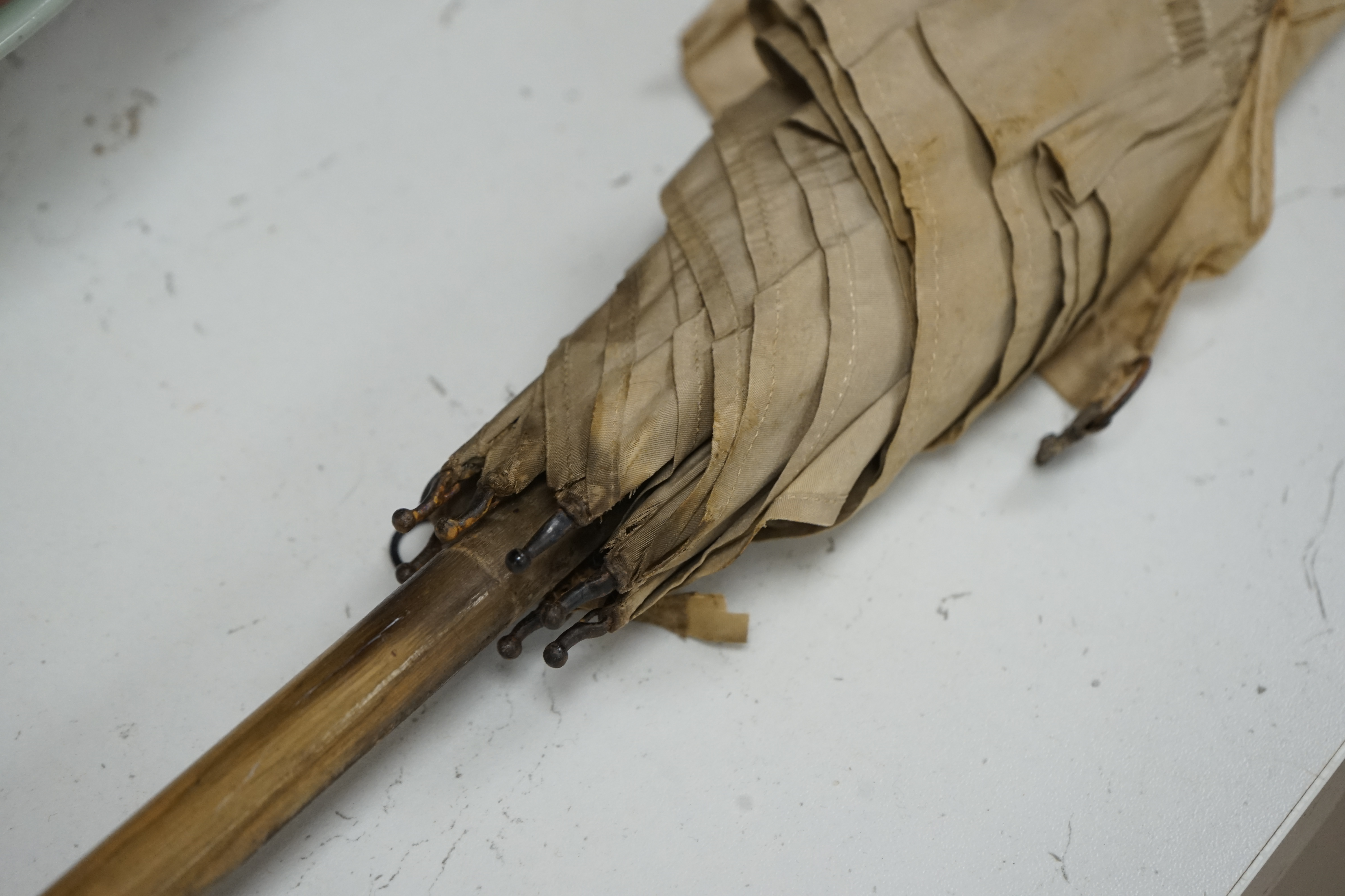 An umbrella, with aventurine quartz handle and yellow metal collar inscribed Brigg, London. (With cover) umbrella 101 cm long. Condition - silk poor, handle good